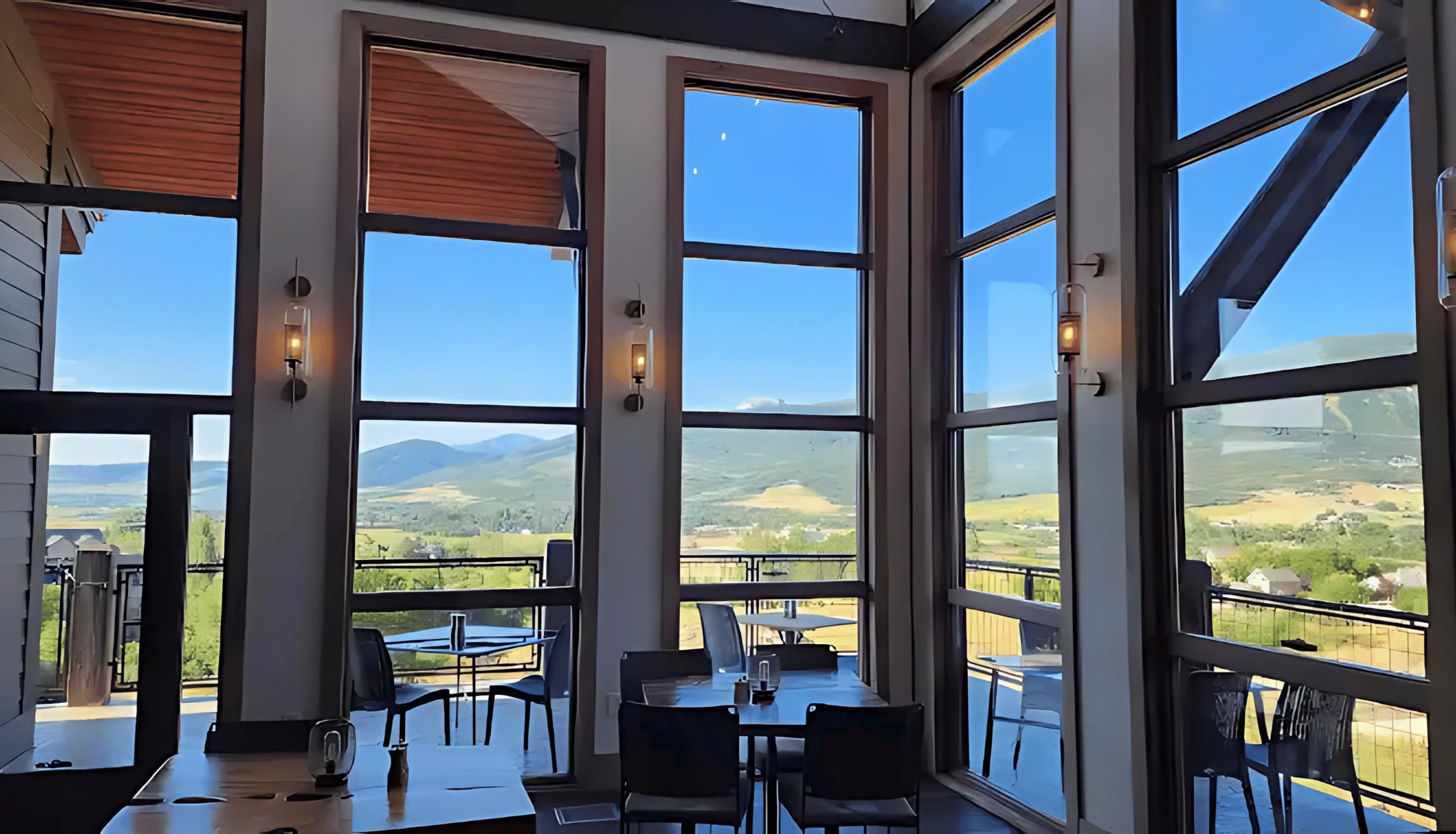 Modern restaurant interior with panoramic mountain views