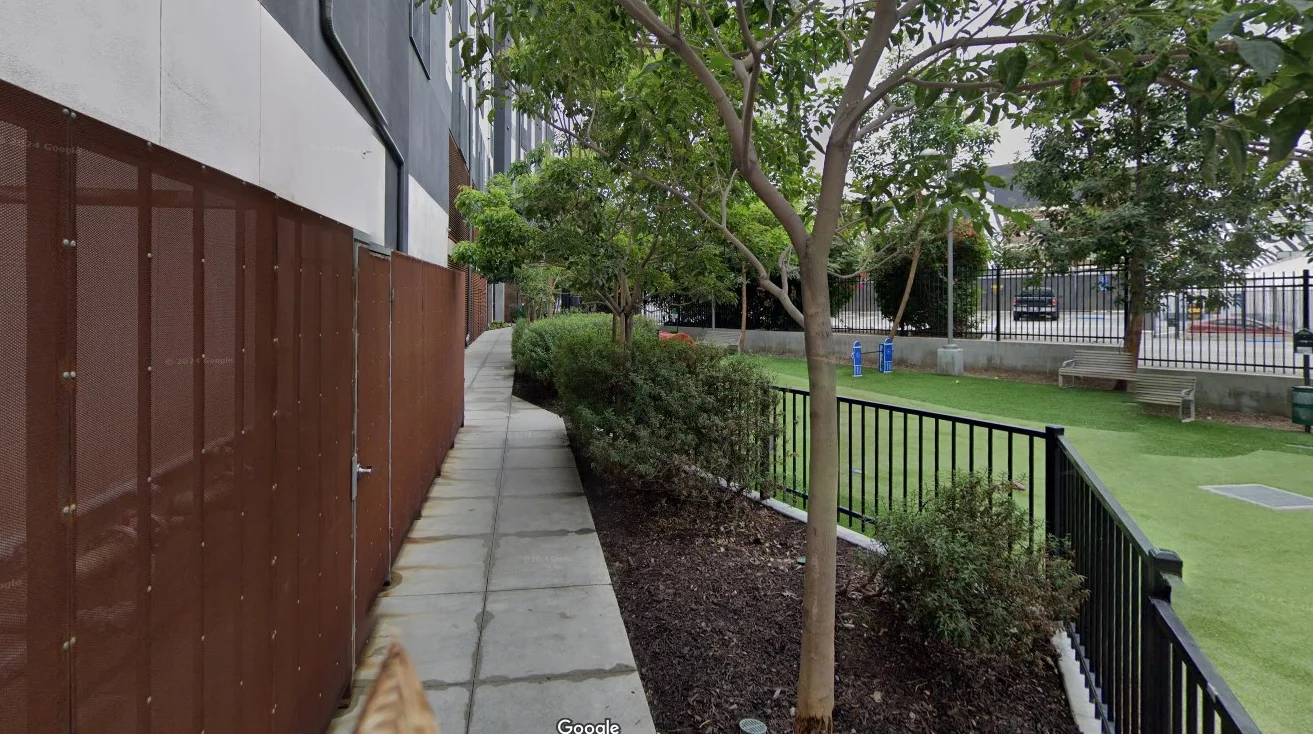 Pathway lined with greenery and modern architecture in Los Angeles