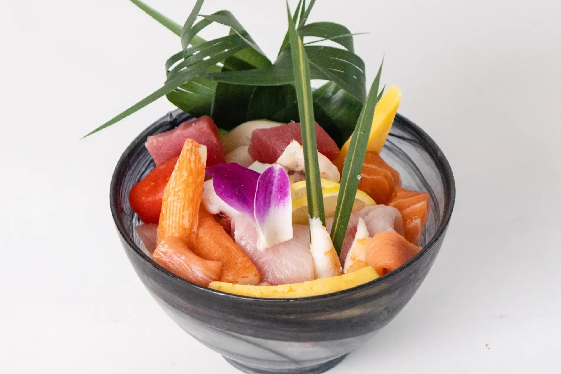 Japanese chirashi sushi bowl with assorted sashimi and garnishes