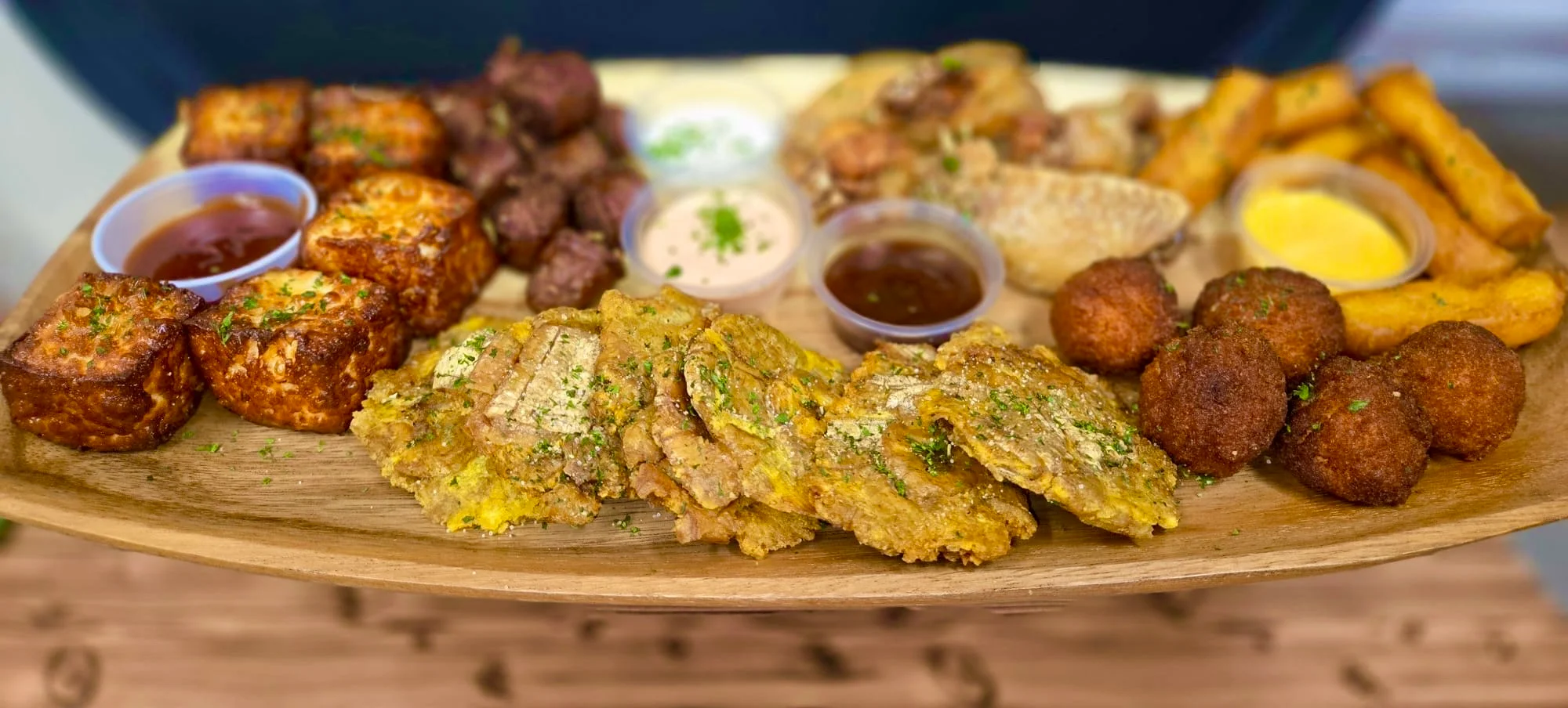 Caribbean platter with fried plantains and assorted meats