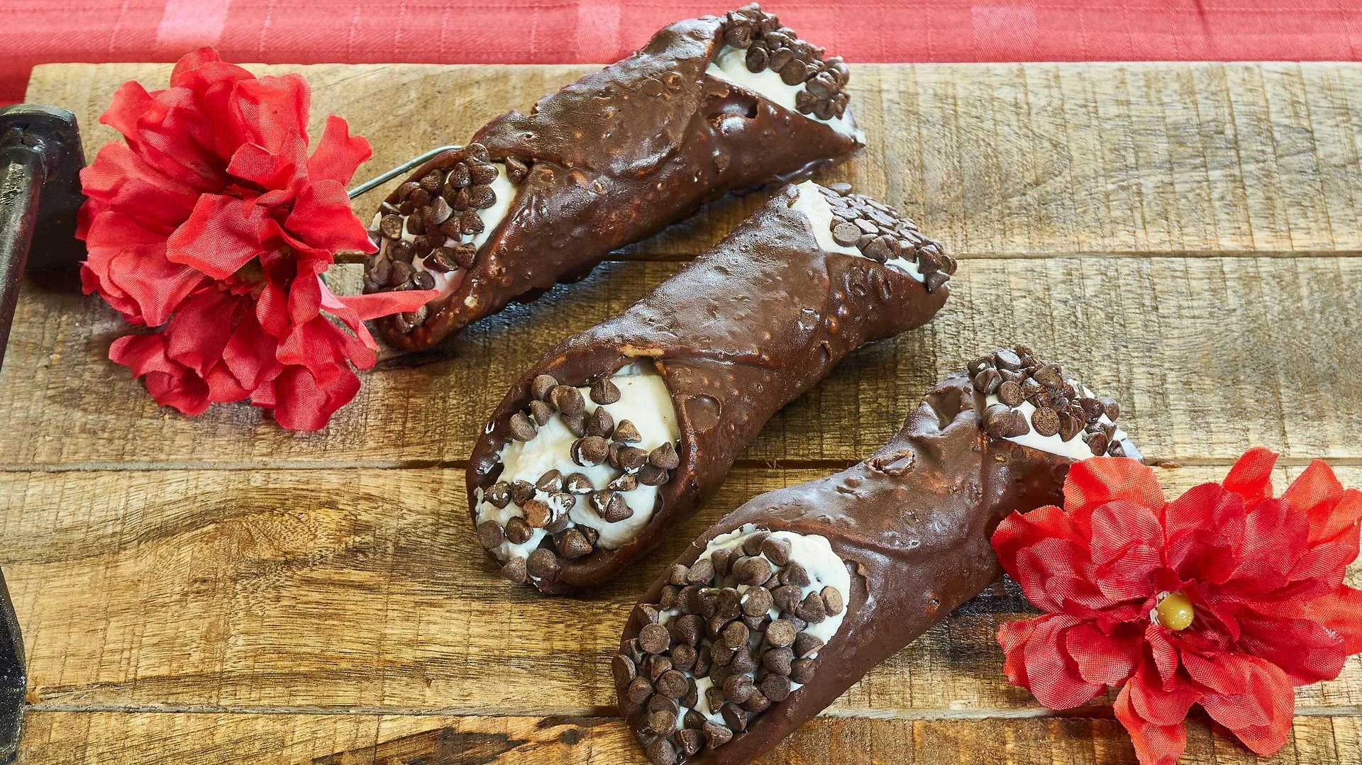 Chocolate cannoli with ricotta filling and chocolate chips