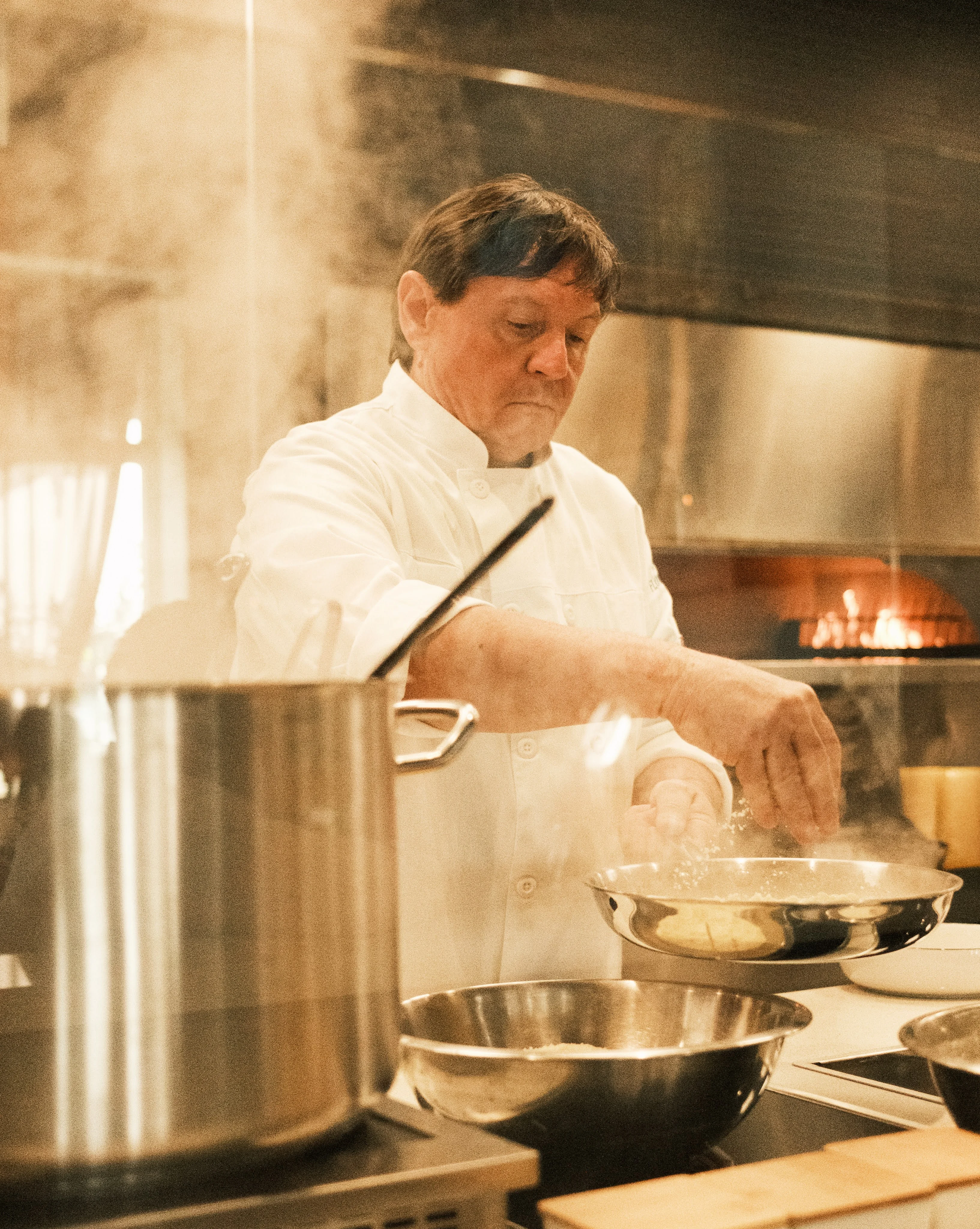 Chef preparing a gourmet dish in a modern kitchen