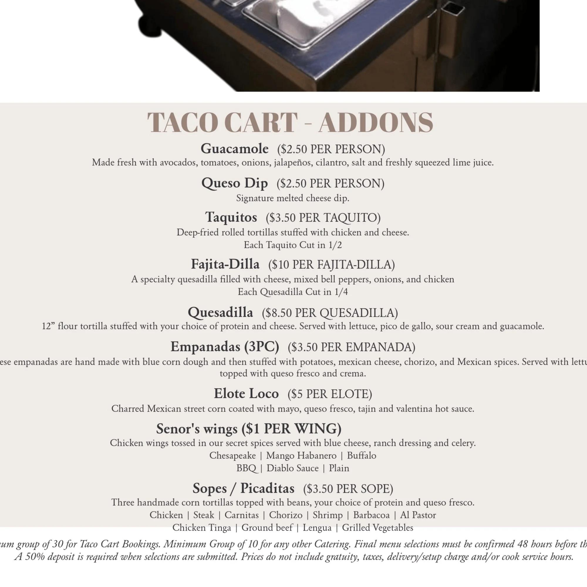 Taco cart with various Mexican food add-ons