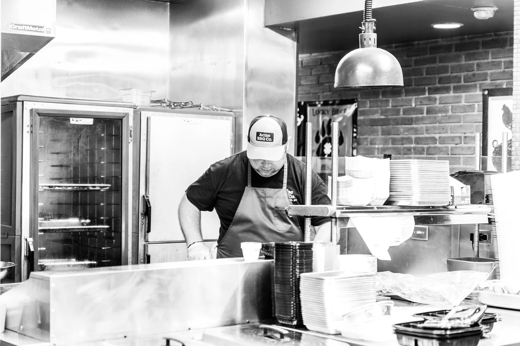 Chef preparing dishes in a bustling restaurant kitchen