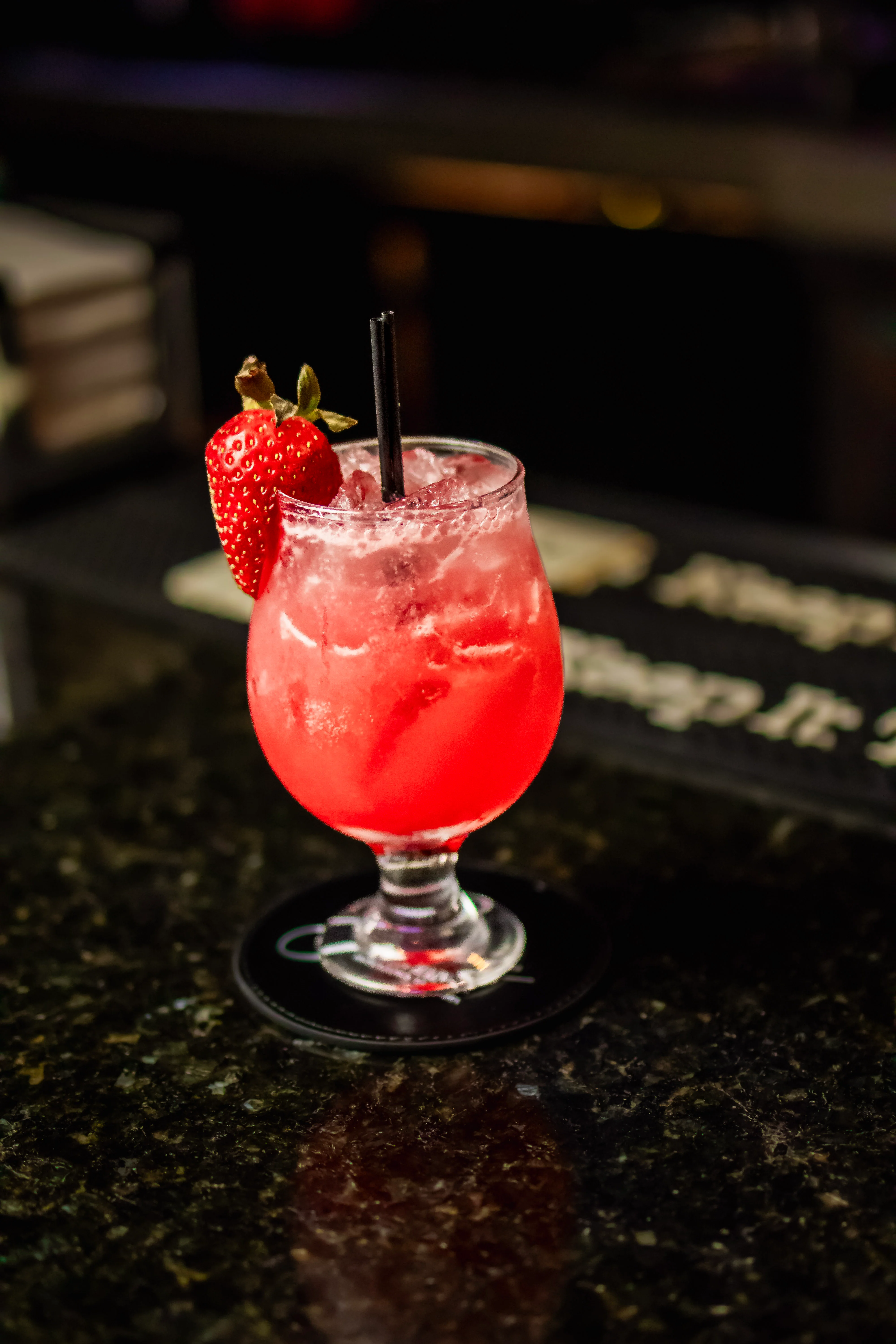 Refreshing strawberry cocktail served in a glass with ice