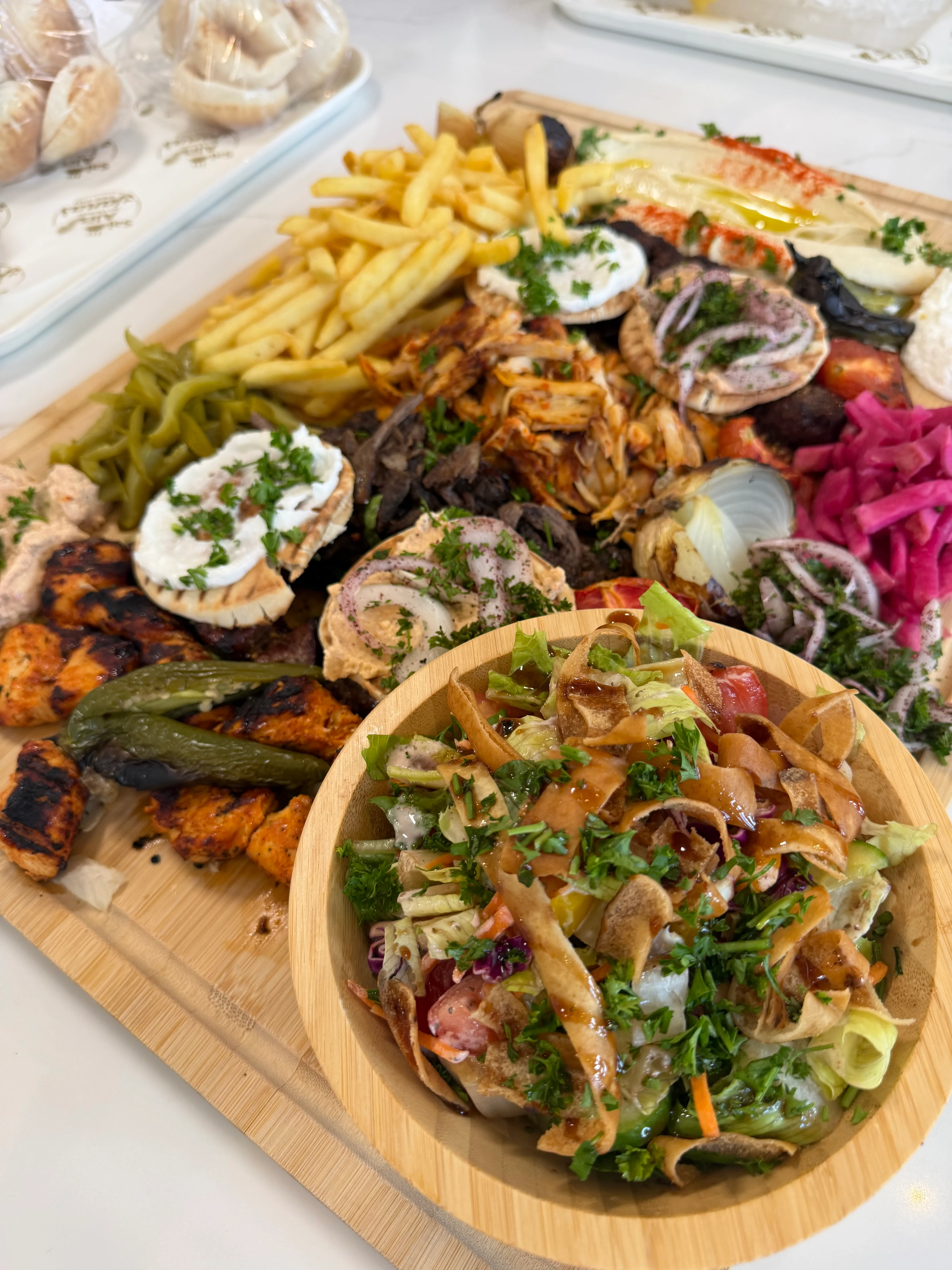 Mixed grill platter with Mediterranean flavors and fresh salad