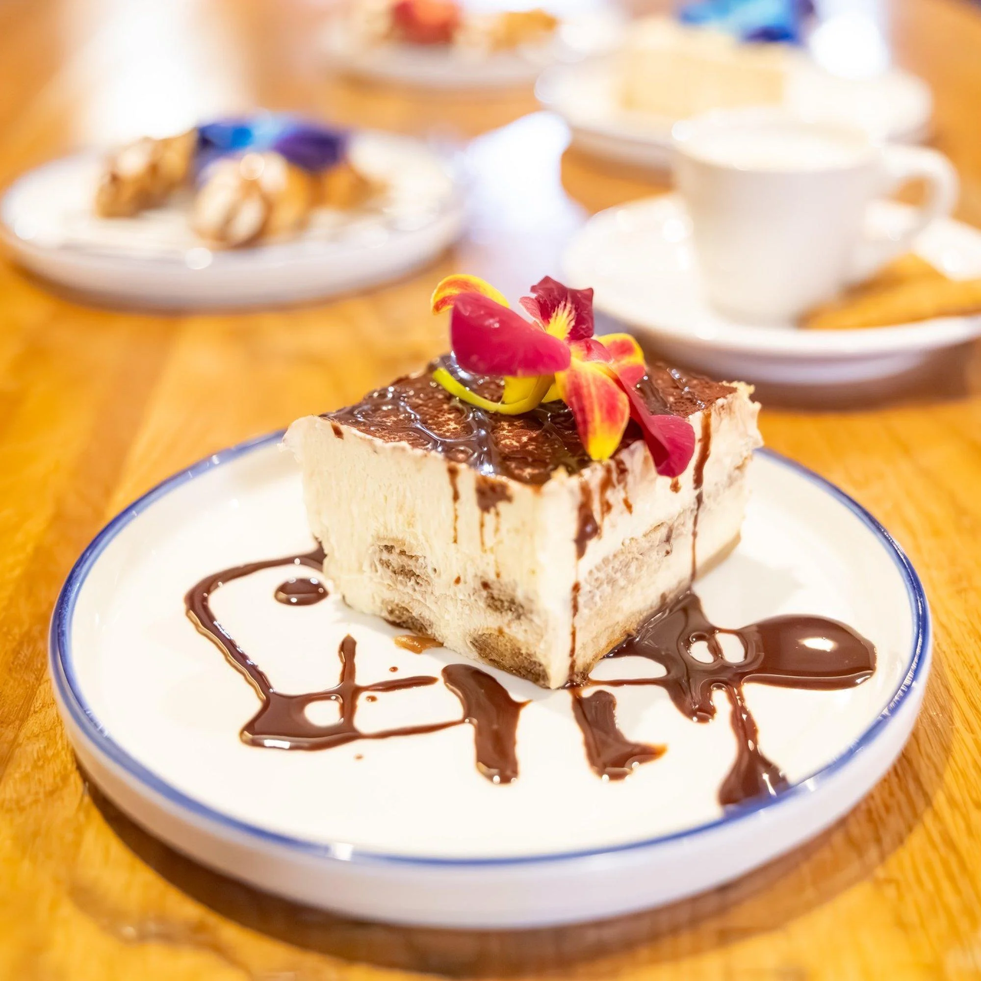 Classic tiramisu with espresso, mascarpone, and chocolate — house-made Italian dessert at Amici, West Palm Beach