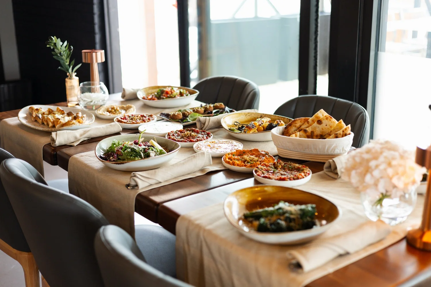 A beautifully arranged table with various dishes and appetizers.