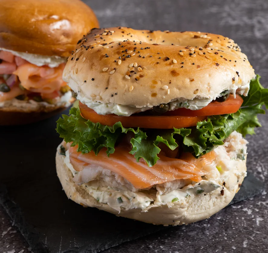 Nova and whitefish salad sandwich on a poppy seed bagel