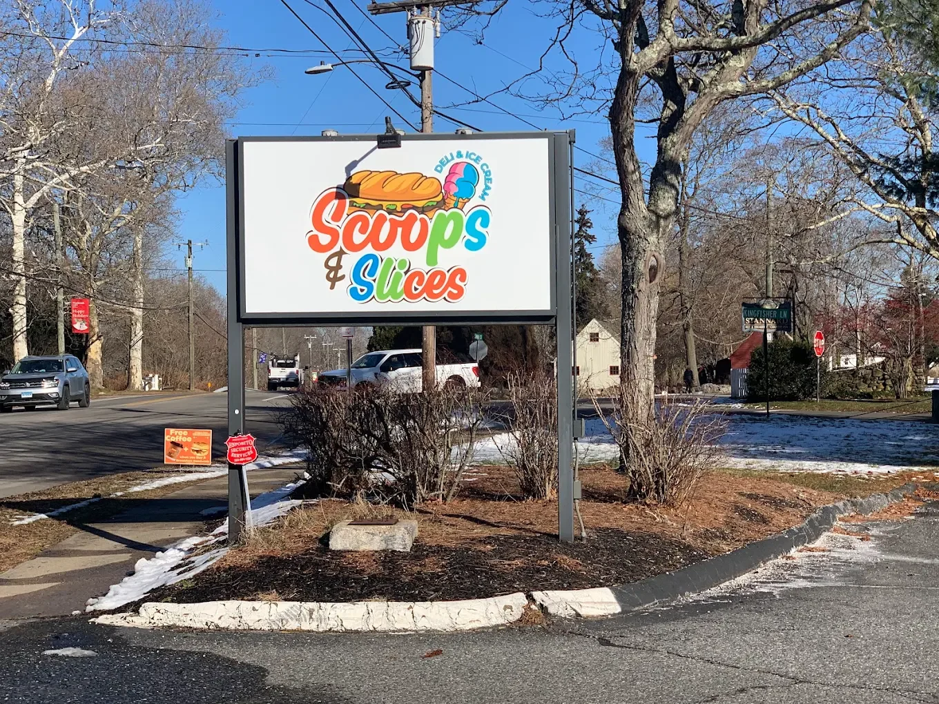 Sign for Scoops & Slices deli and ice cream shop