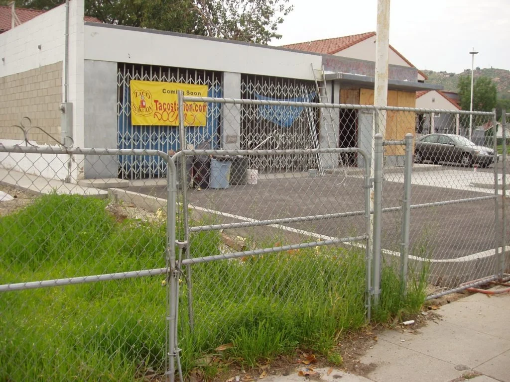 Taco restaurant under construction with a coming soon sign