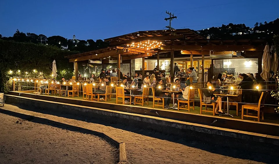 Bar Bocce at night, tables set up outside to seat up to 70 people