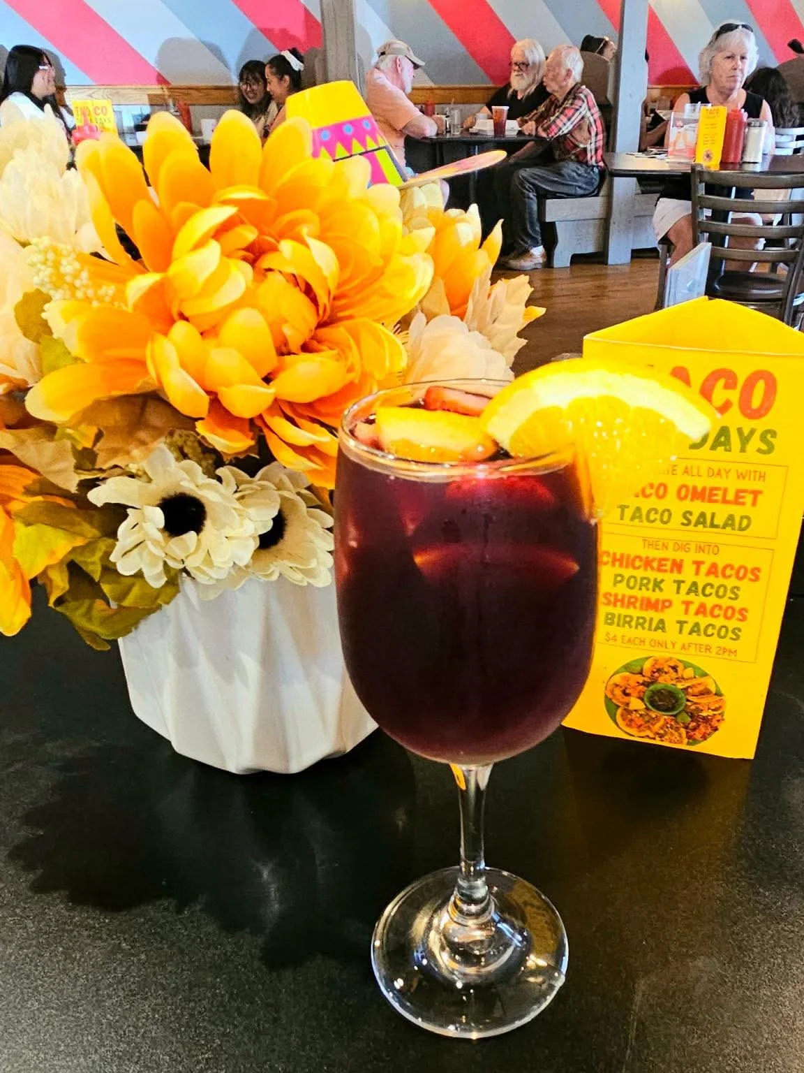 Refreshing sangria cocktail in a vibrant restaurant setting