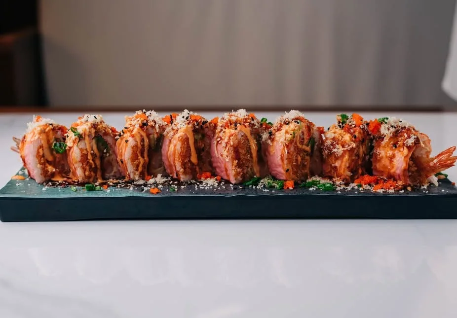 Japanese sushi rolls with crispy shrimp and spicy sauce