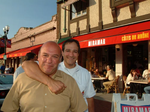 Exterior view of Miramar restaurant with patrons dining outside