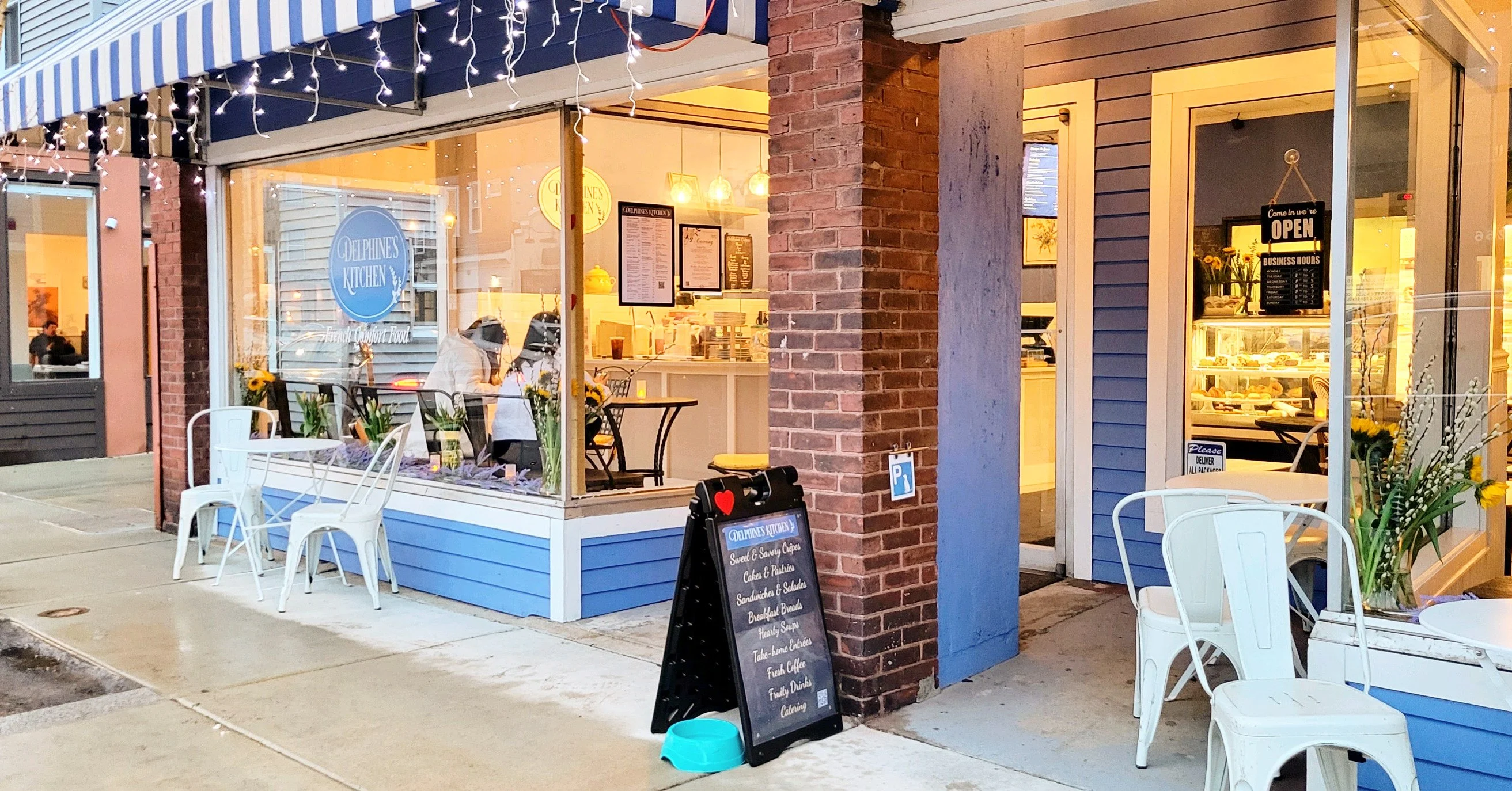 Charming café exterior with outdoor seating and welcoming ambiance