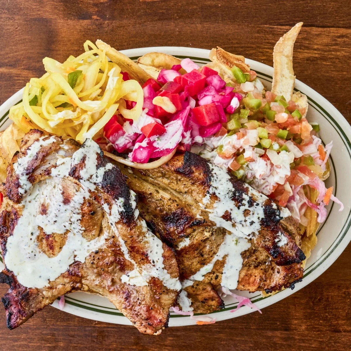 Grilled chicken shawarma platter with fresh toppings