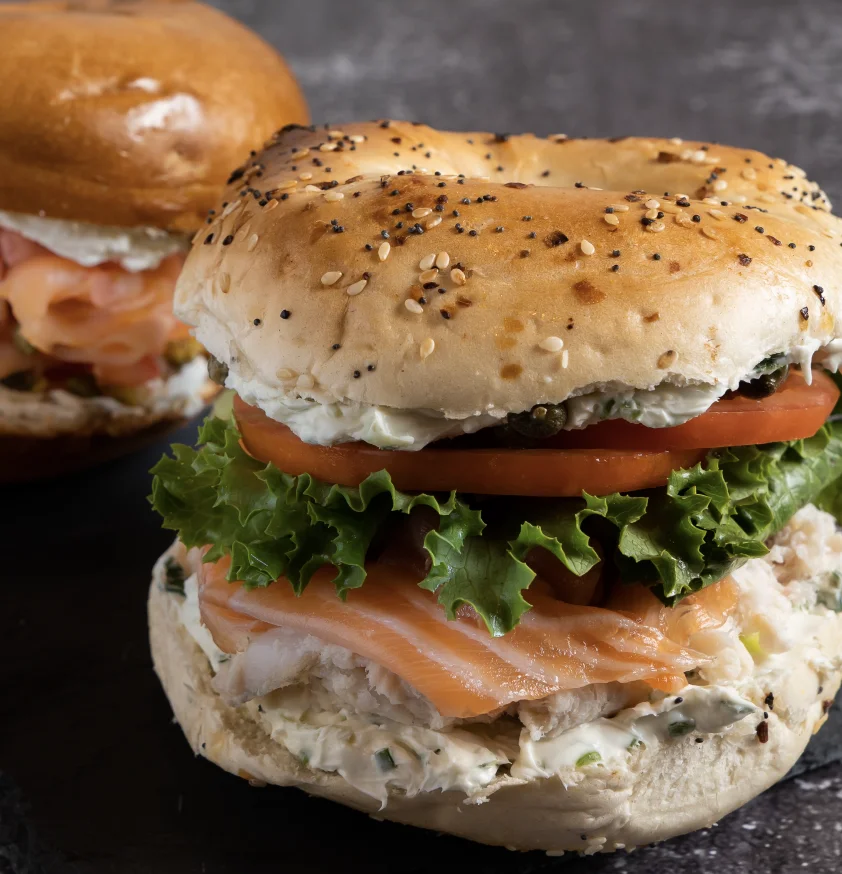 Nova and whitefish salad sandwich on a poppy seed bagel