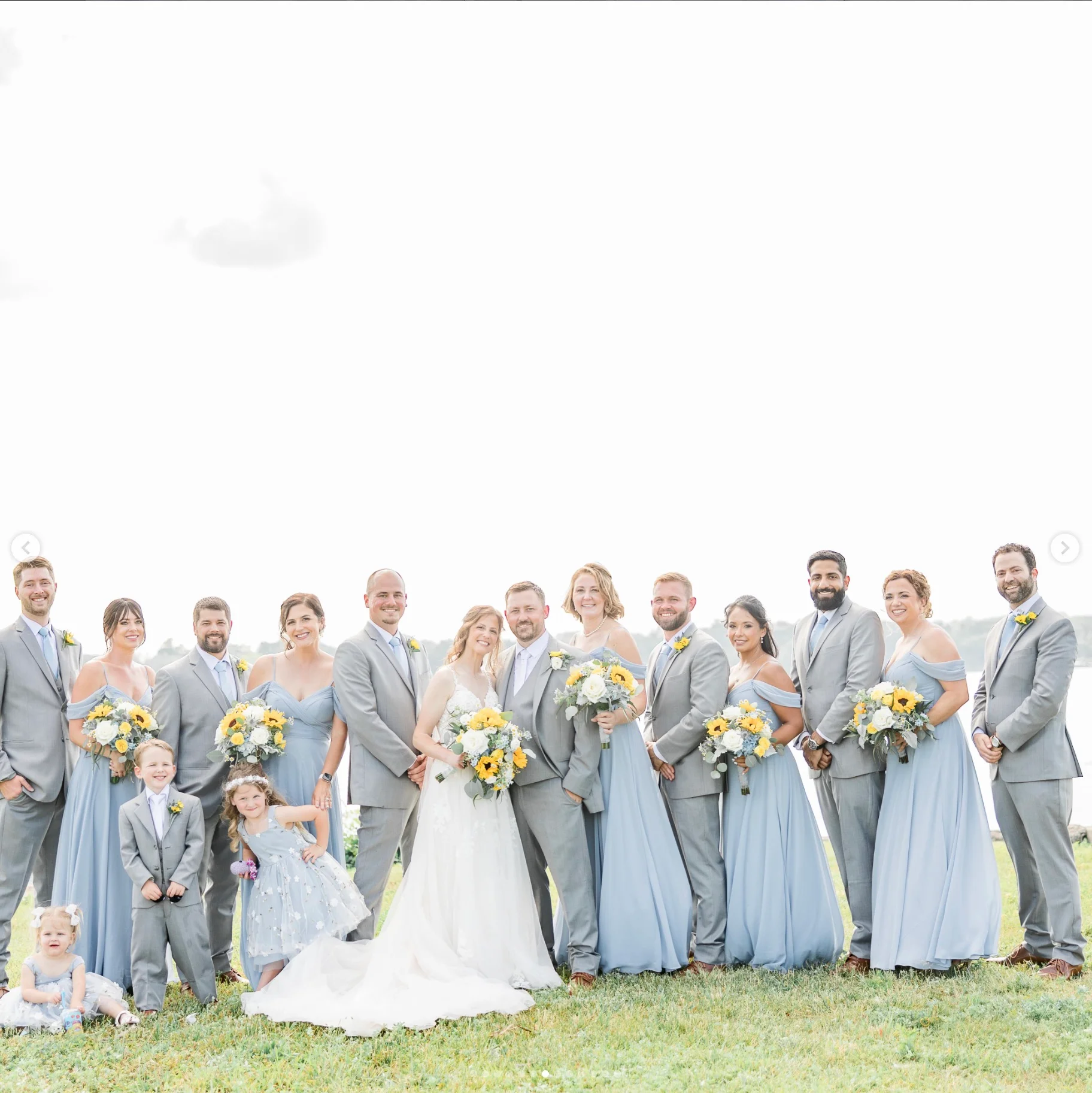 Wedding party in elegant attire with floral bouquets
