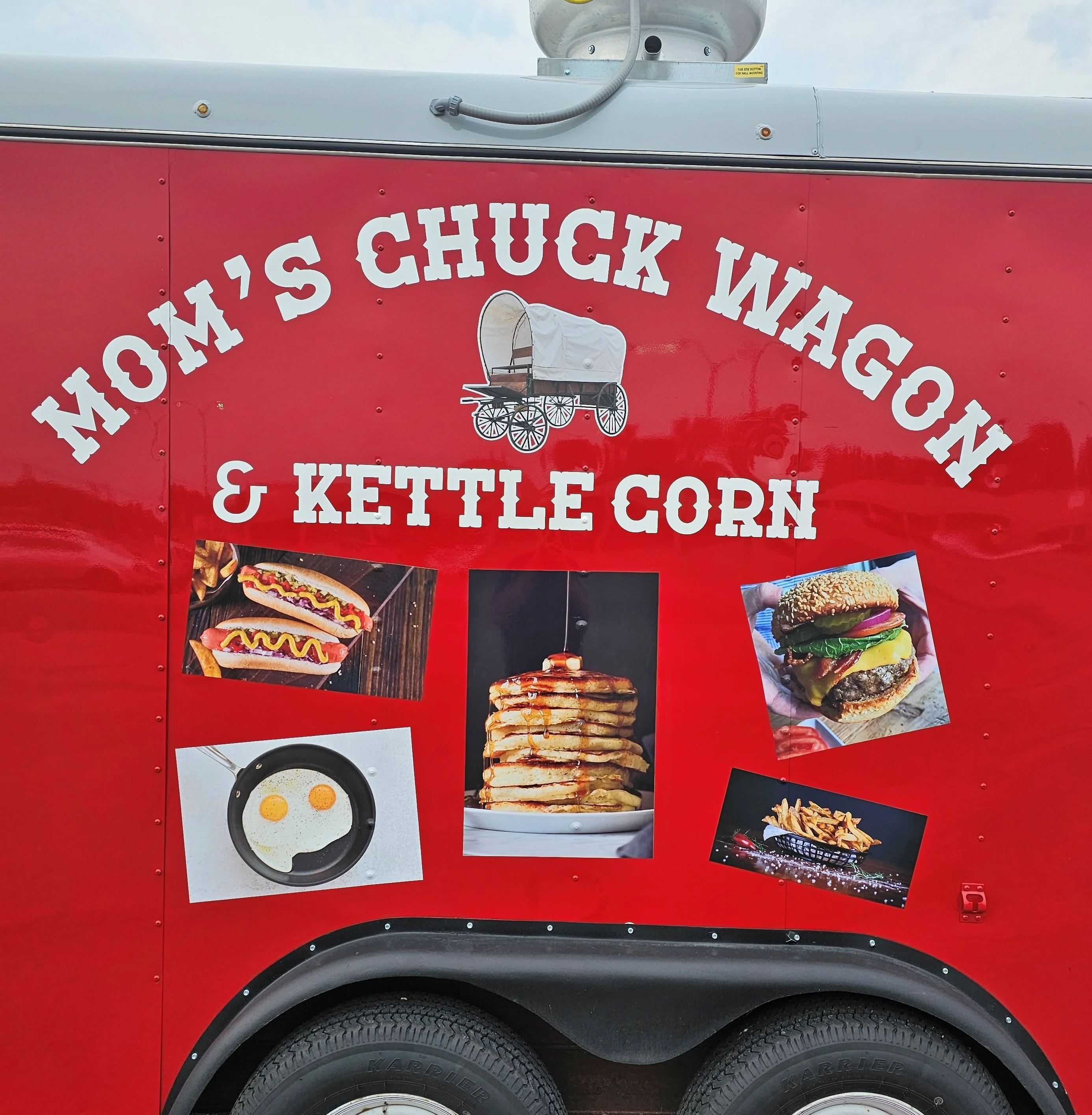 Food trailer with a vibrant exterior and outdoor seating area.