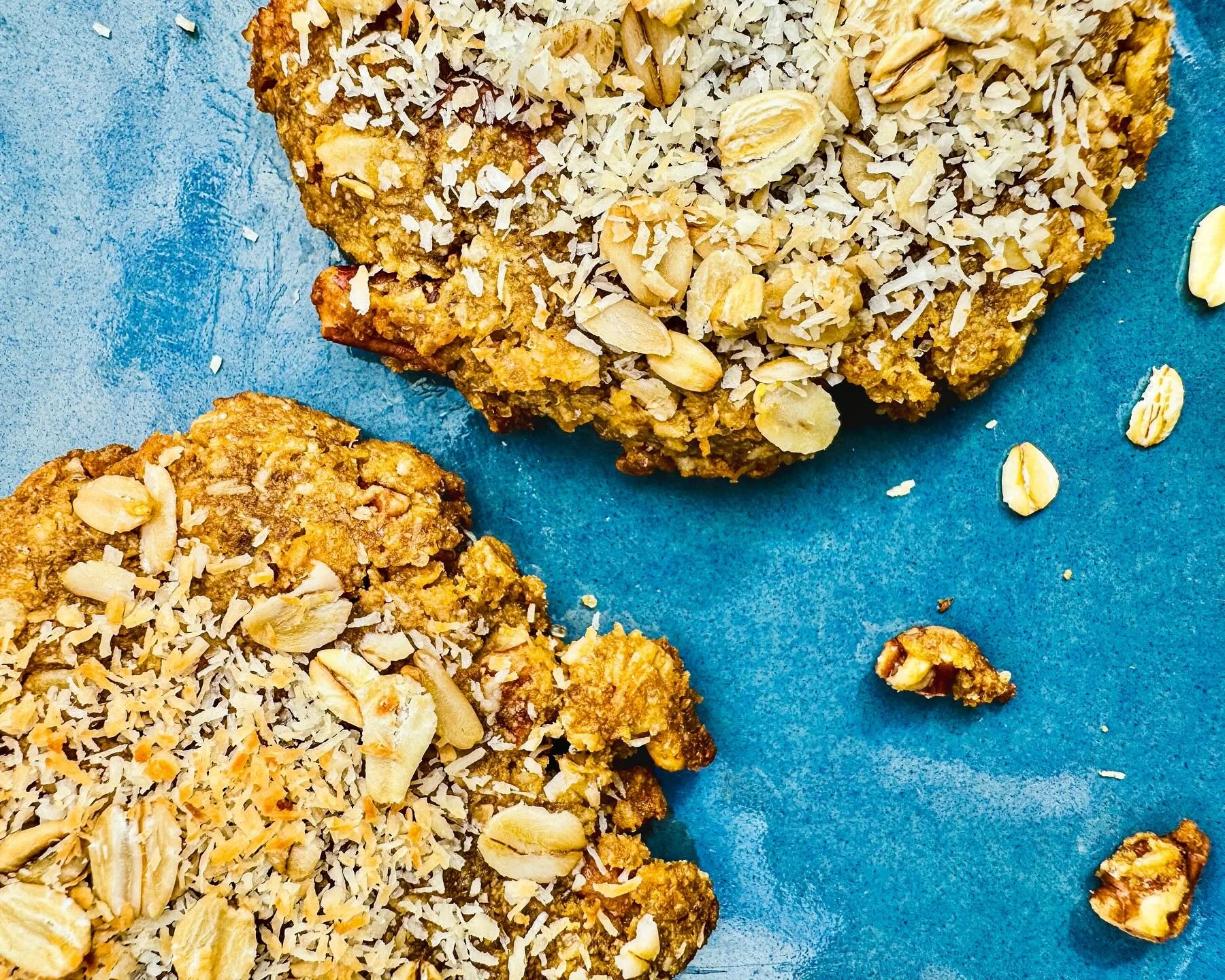 Oatmeal cookies with coconut and nuts on a blue plate