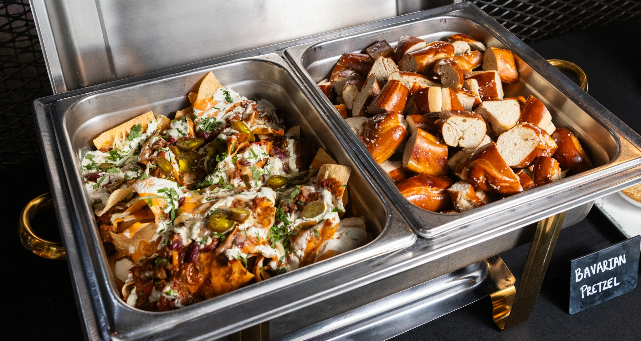 catering dishes with nachos and pretzels