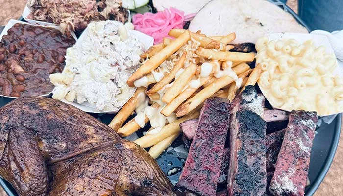Texas-style barbecue platter with smoked meats and sides