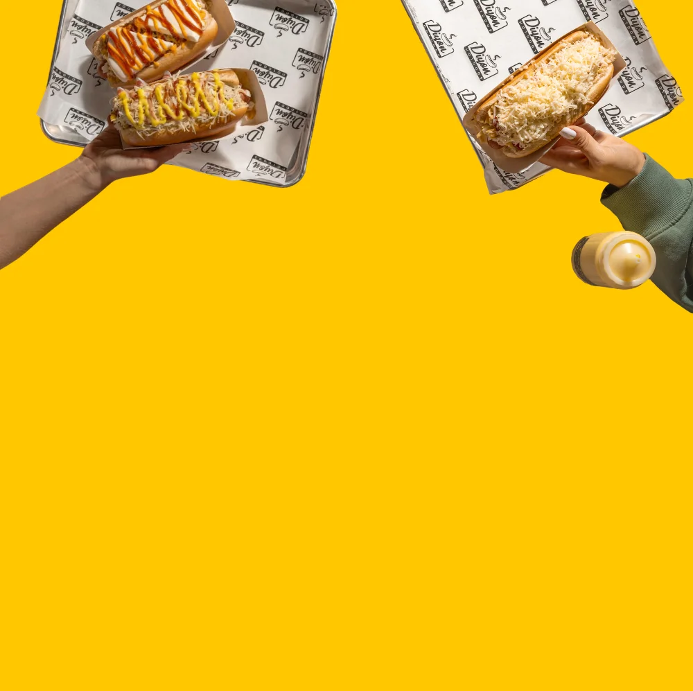 Gourmet hot dogs served on colorful trays
