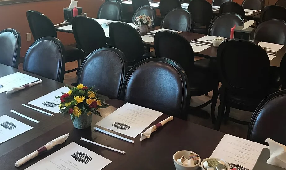 Cozy restaurant dining area with tables and floral centerpieces