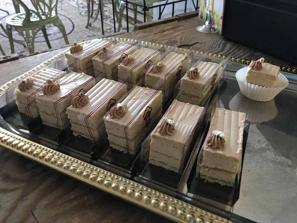 Elegant coffee mousse cake slices on a decorative platter