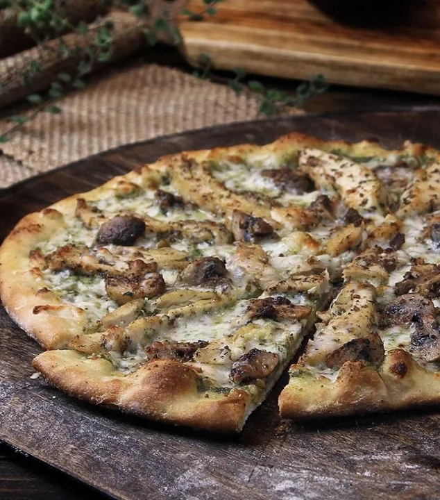 Grilled chicken flatbread pizza with herbs