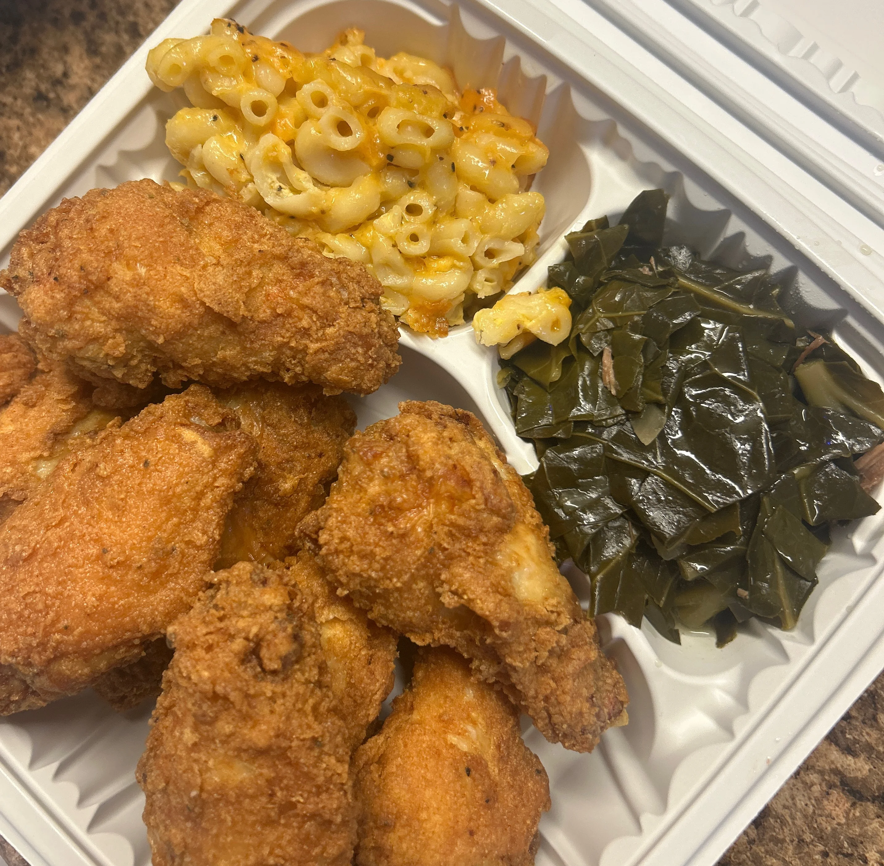Southern fried chicken with mac and cheese and collard greens