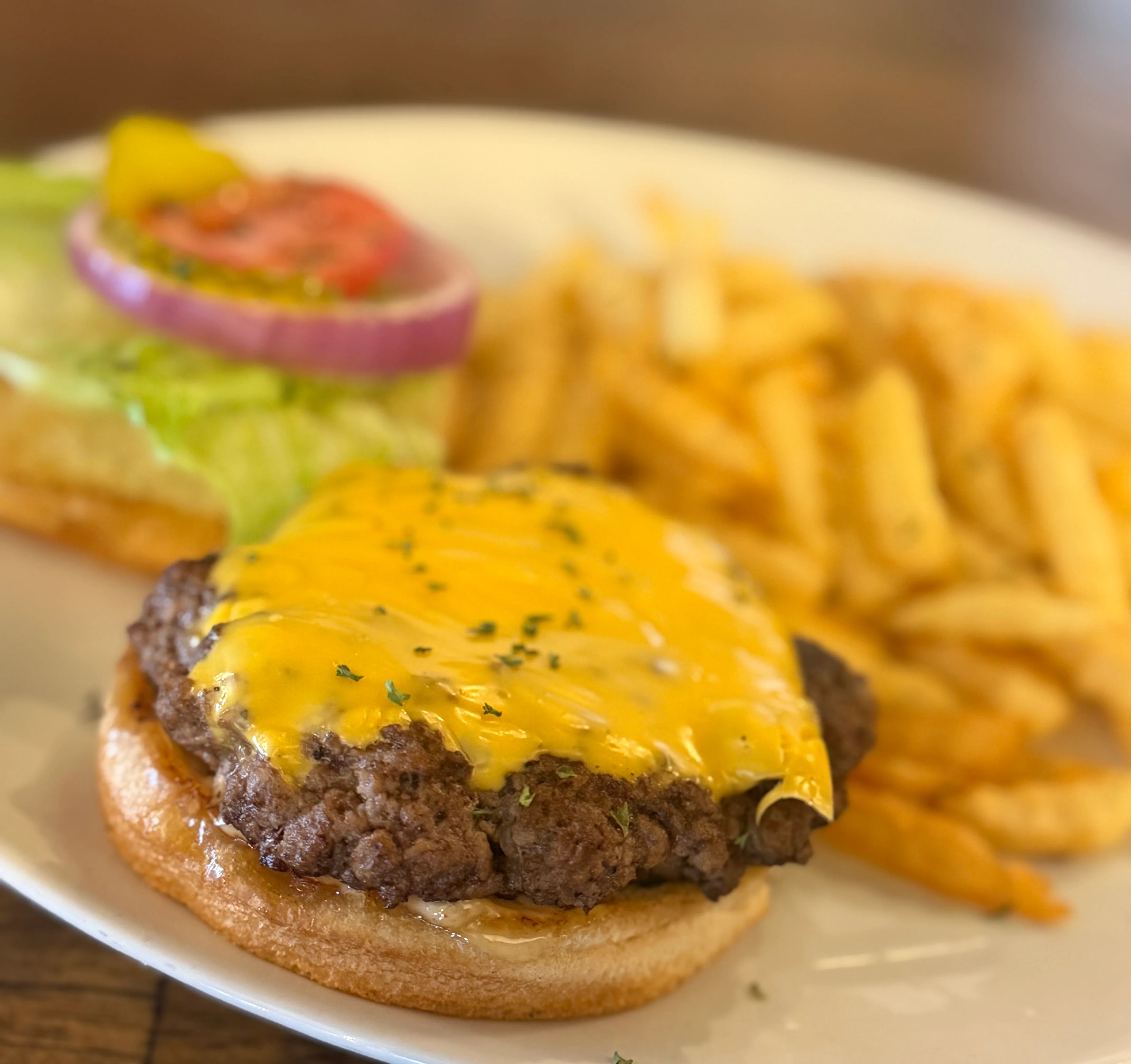 Classic American cheeseburger with fries