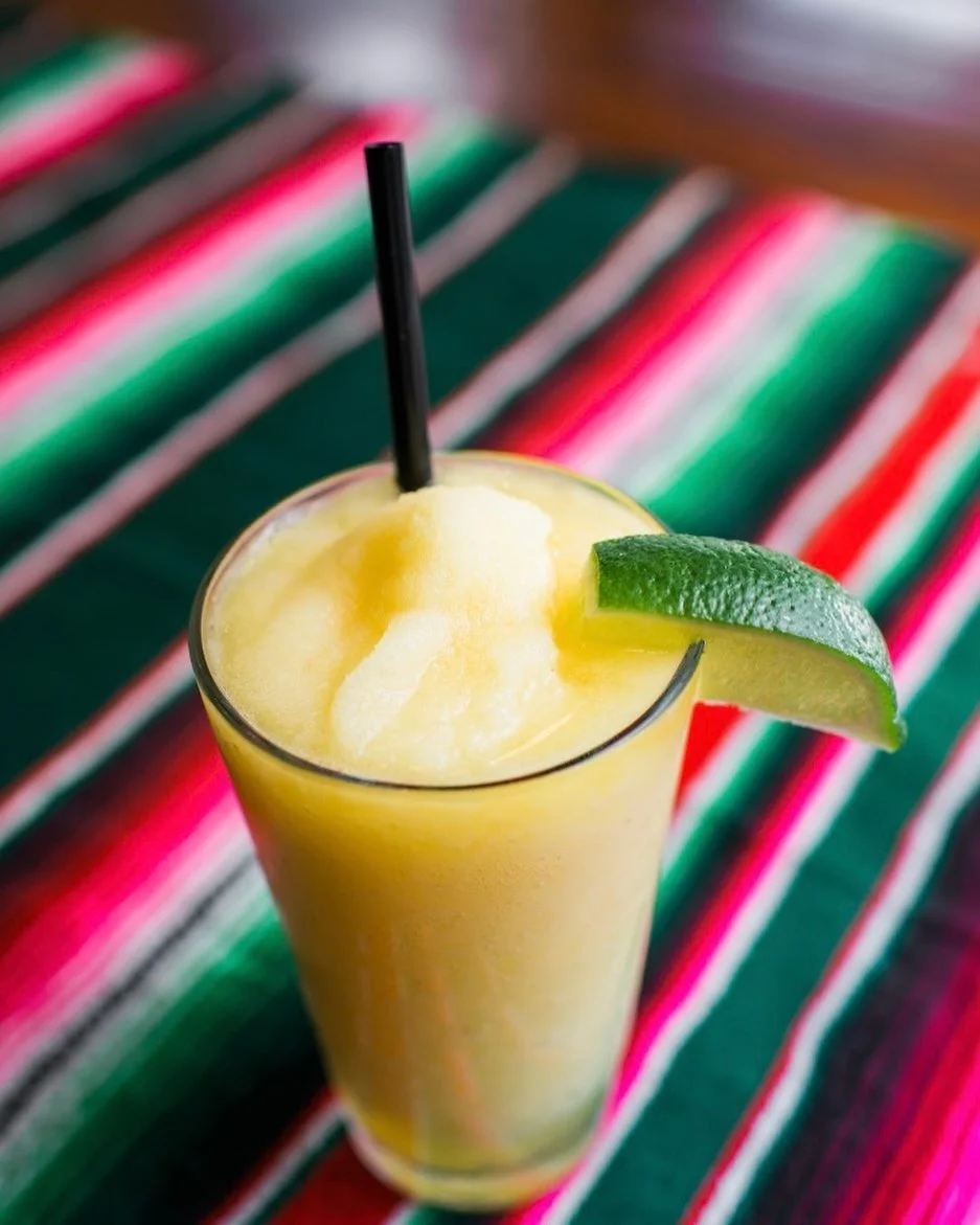 Frozen margarita with lime on a Mexican blanket at Aztecon Broadway Restaurant