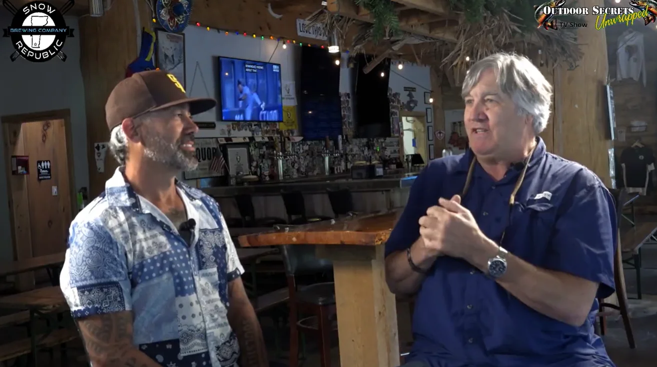 Interview setting in a lively bar with two speakers
