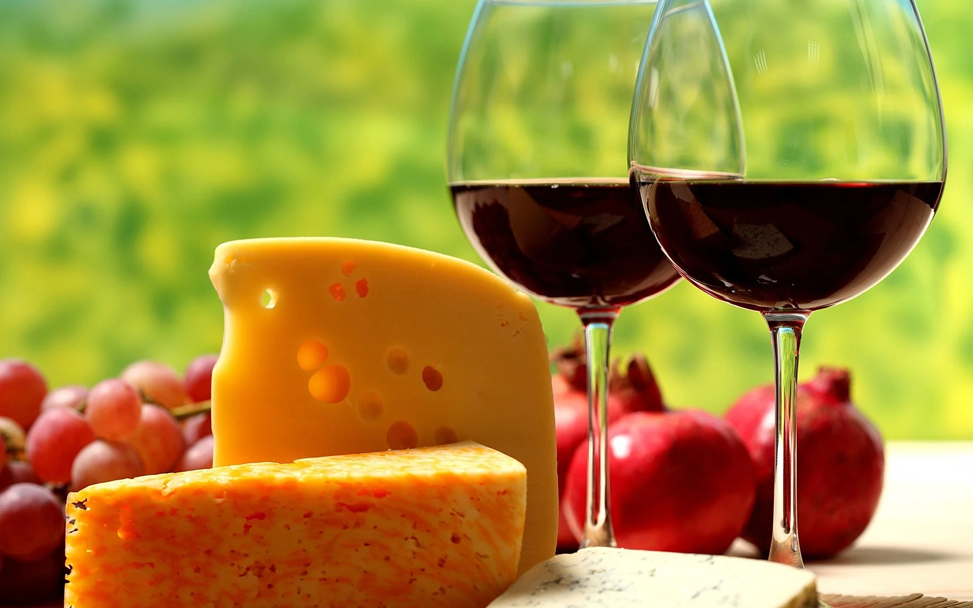 Cheese platter with red wine and grapes