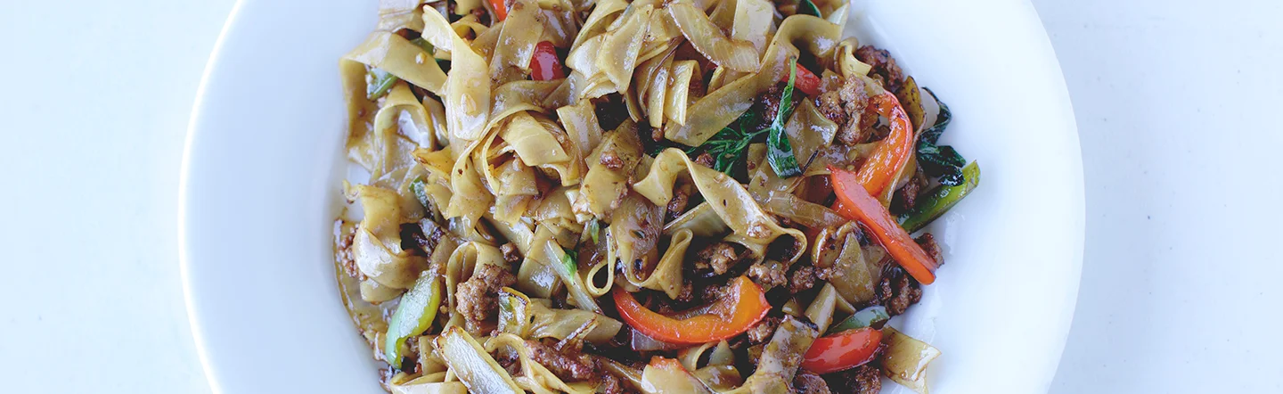 Stir-fried Chinese chow fun with vegetables and meat