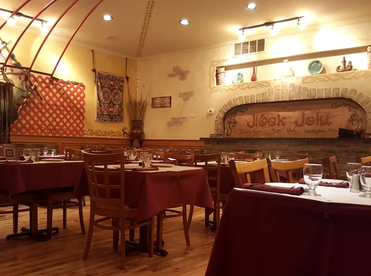 Cozy restaurant interior with warm lighting and rustic decor