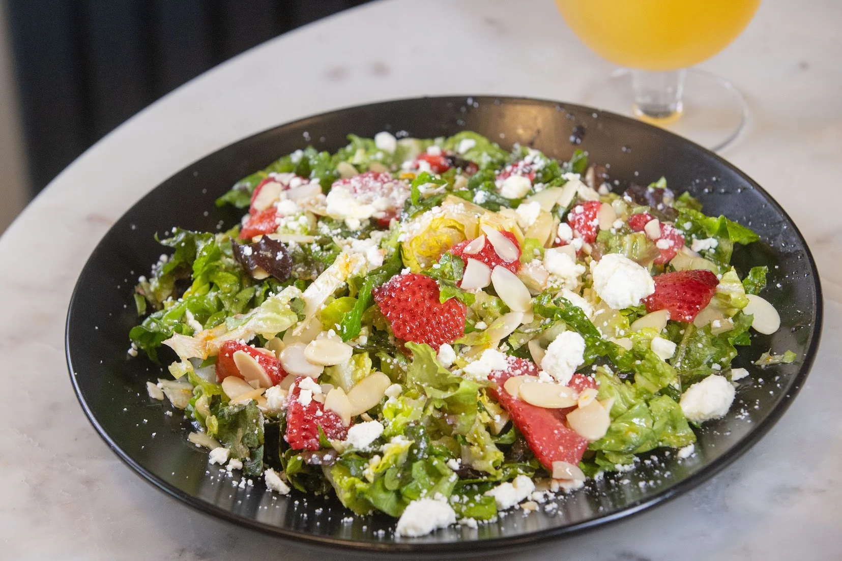 Fresh strawberry salad with mixed greens