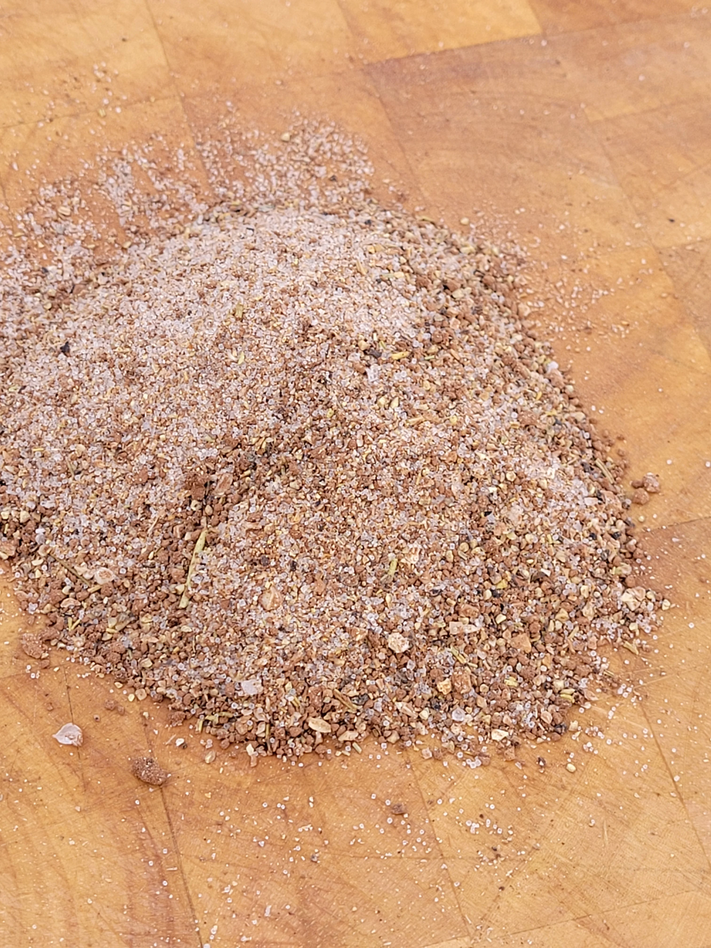 Spice blend for Middle Eastern dishes on a wooden surface