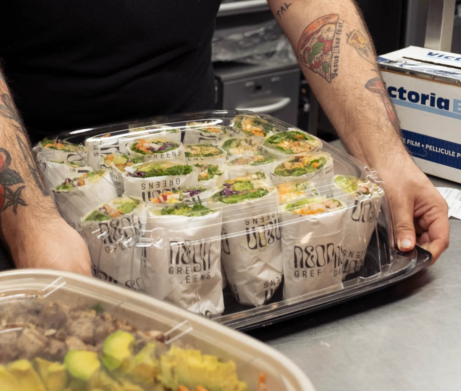 Fresh Vietnamese spring rolls in a takeout container