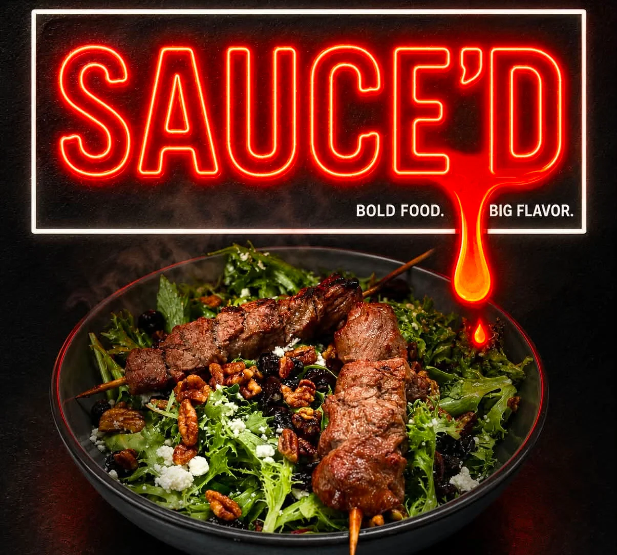 Grilled beef skewers on a fresh salad bowl