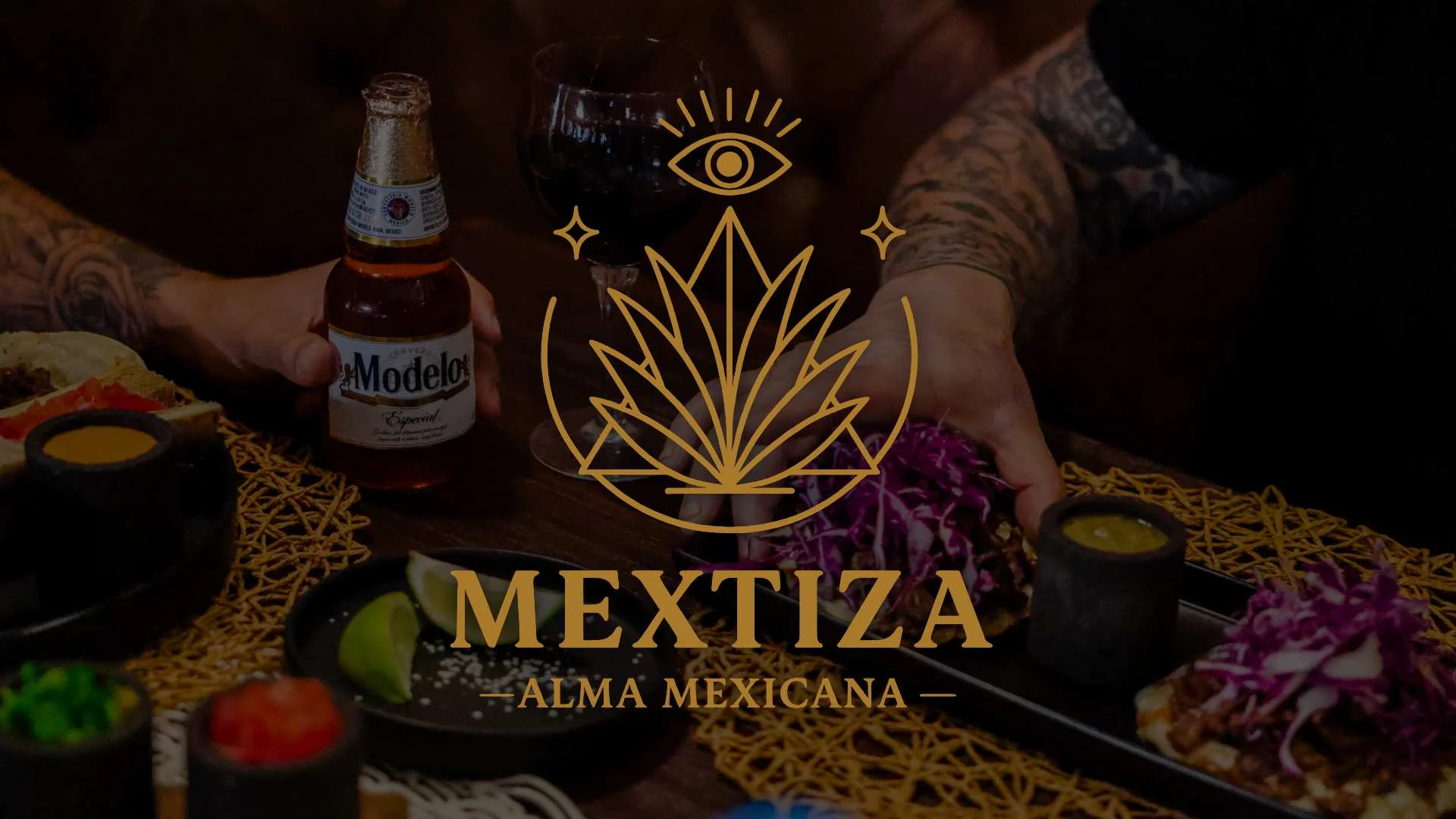 Mexican tacos served with beer and vibrant garnishes