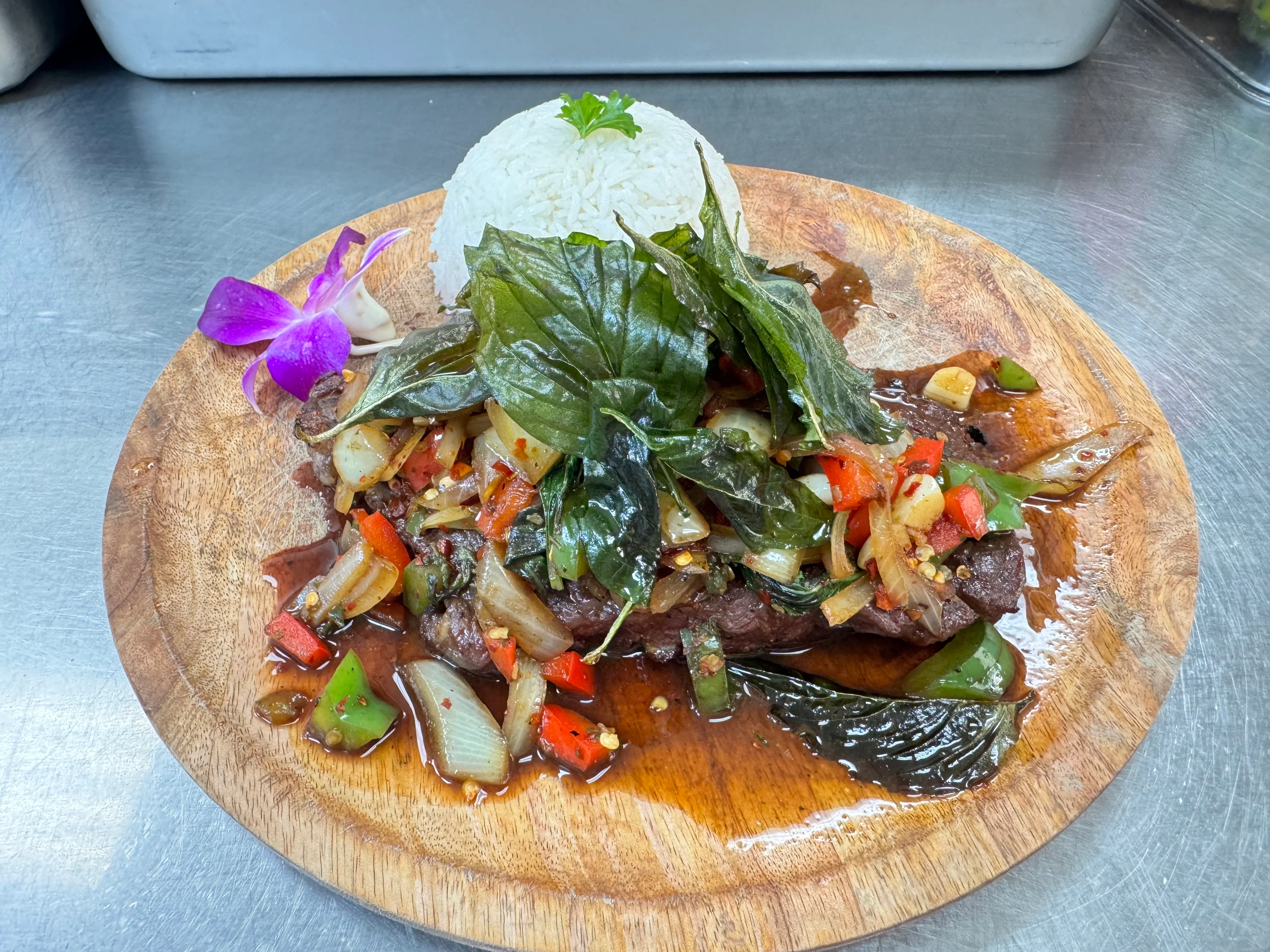 Sizzling Thai beef stir-fry with rice and fresh herbs