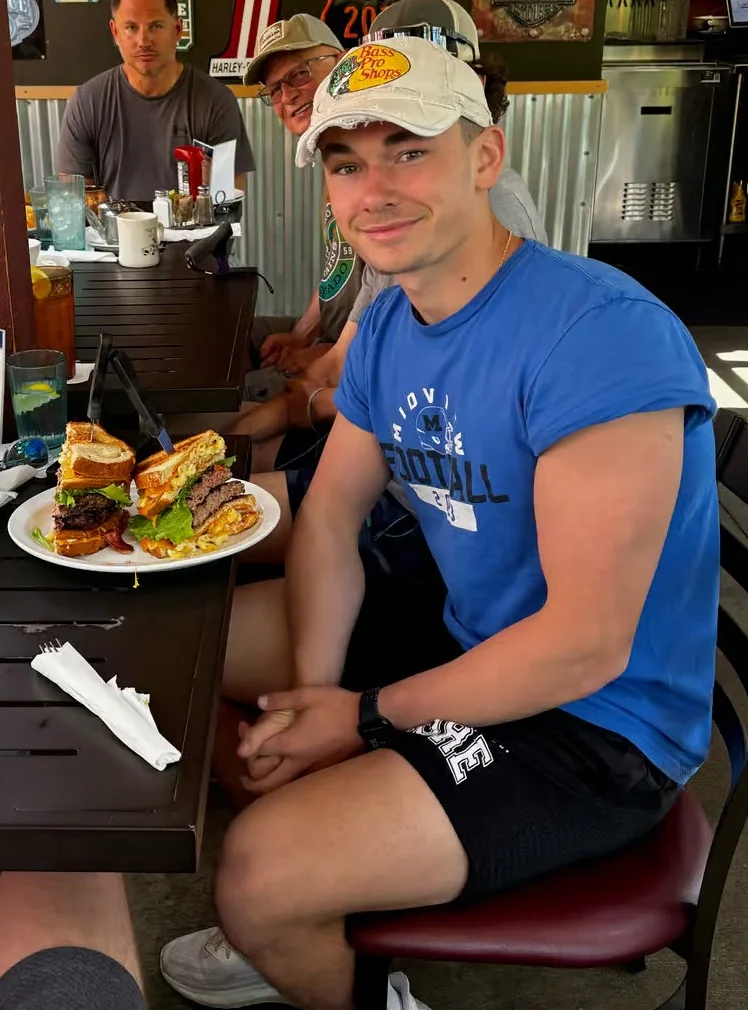 Group enjoying burgers in a casual restaurant setting