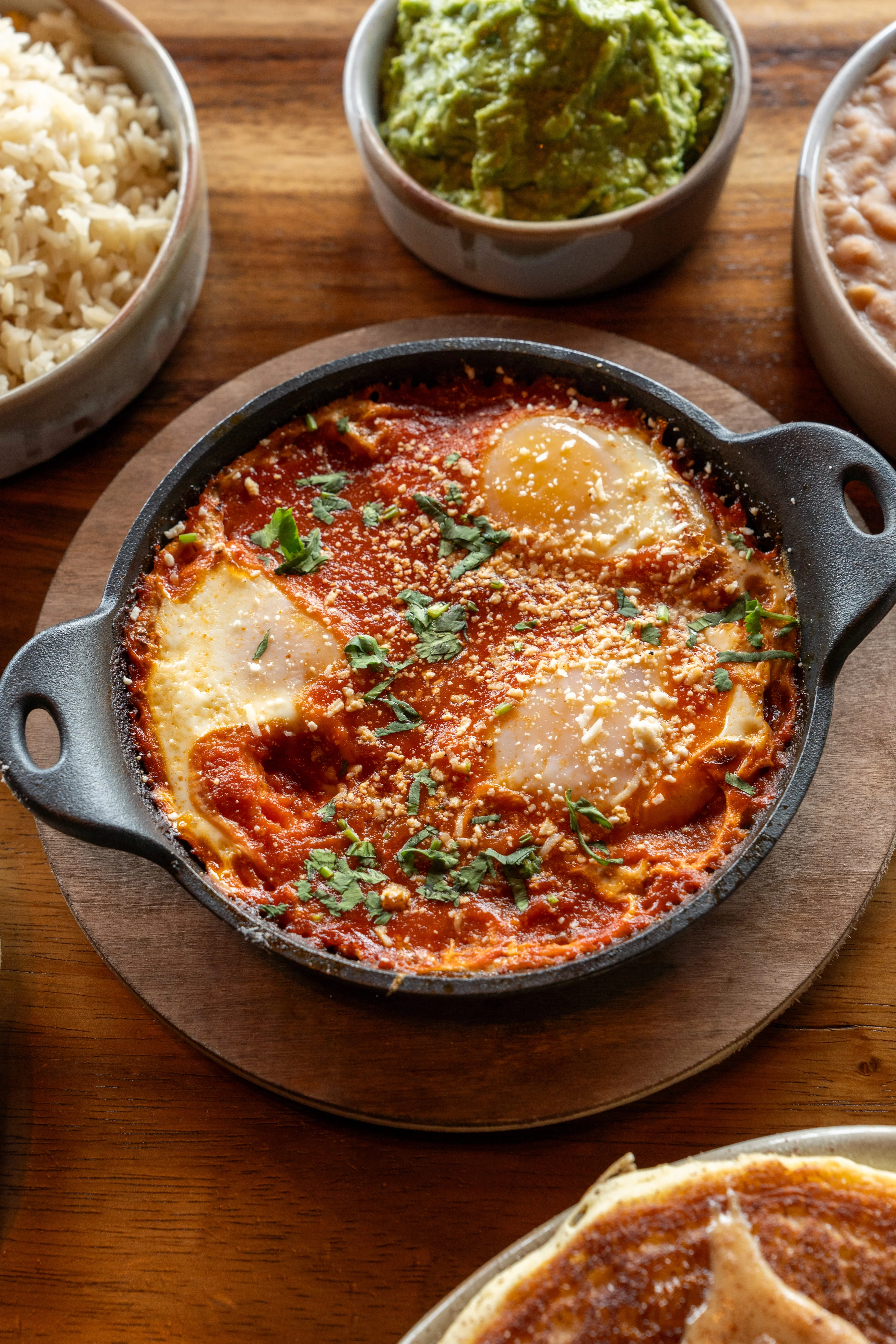 Mexican huevos rancheros served in a skillet