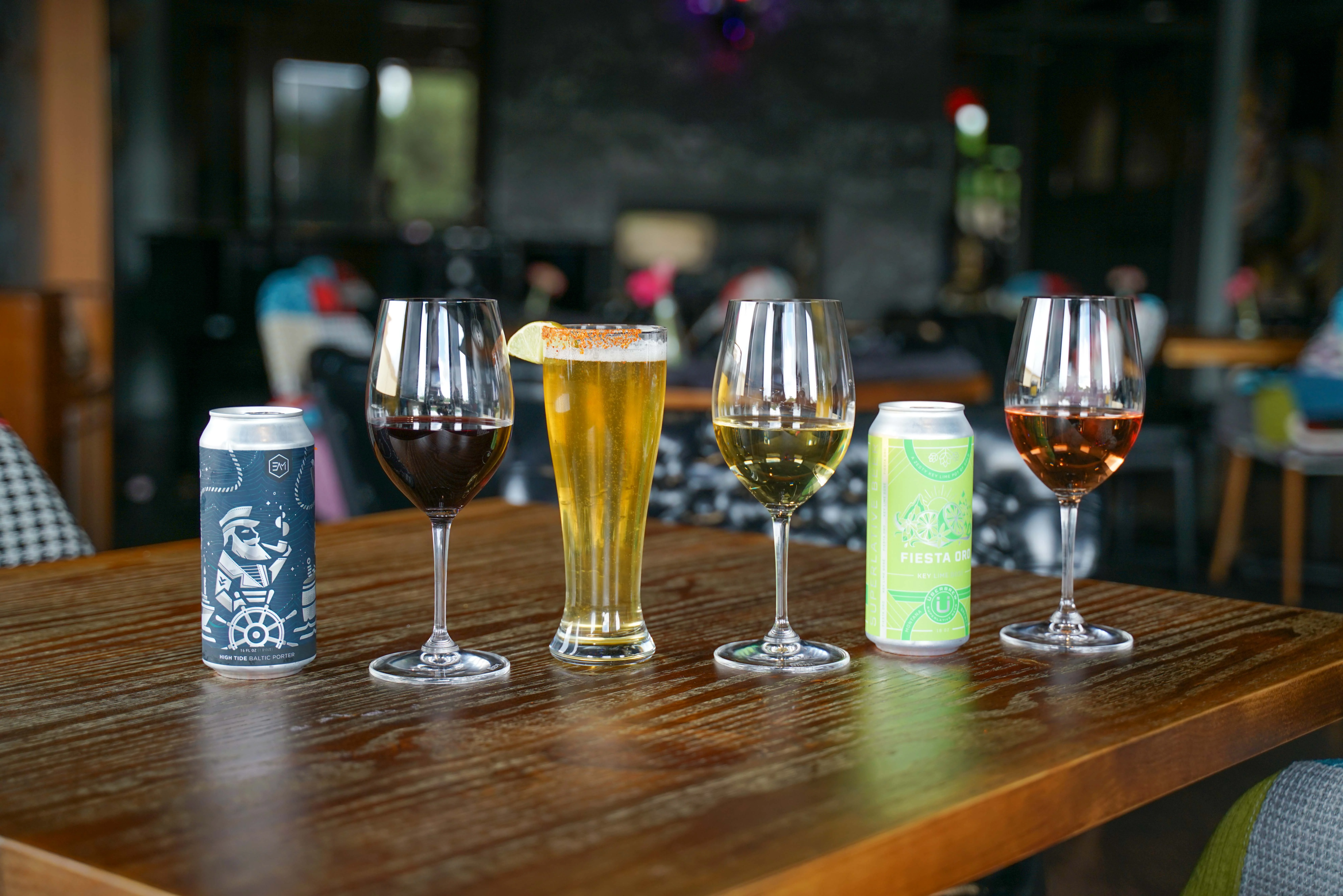 Variety of drinks including beer and wine in a modern restaurant setting