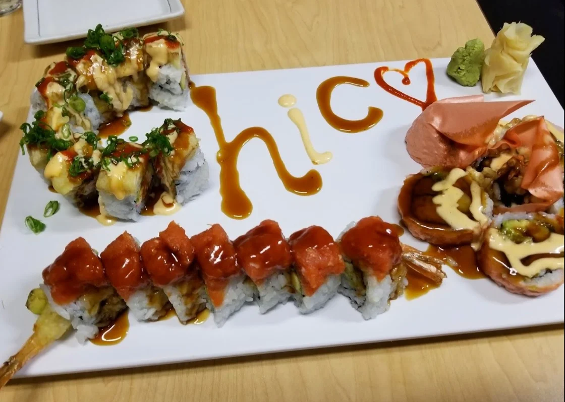 Artfully arranged sushi platter with various rolls