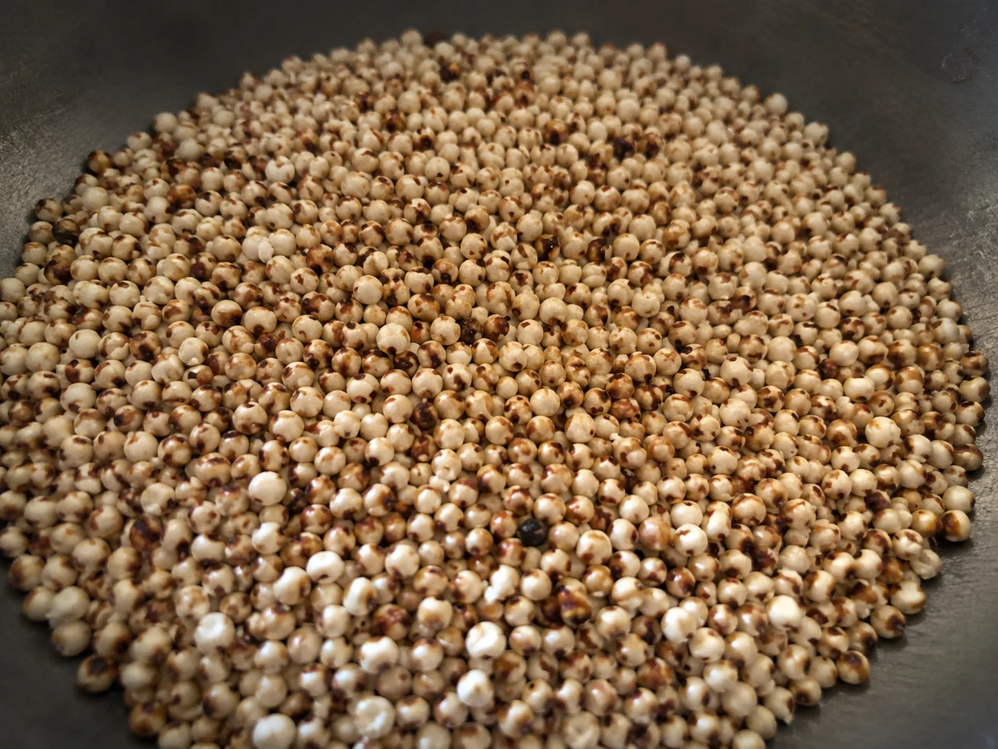 Toasted sorghum grains in a pan