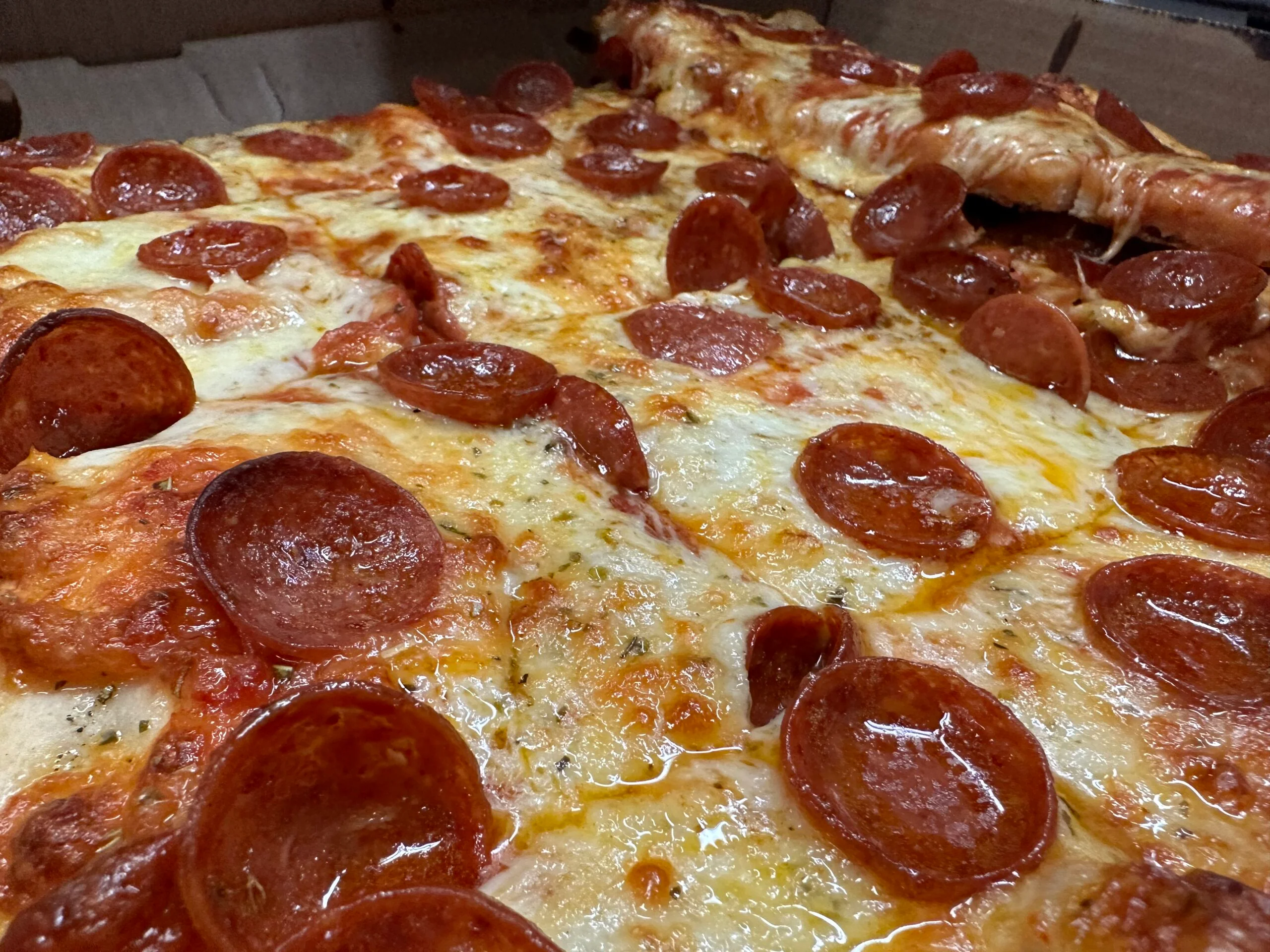 Pepperoni pizza with melted cheese and crispy crust